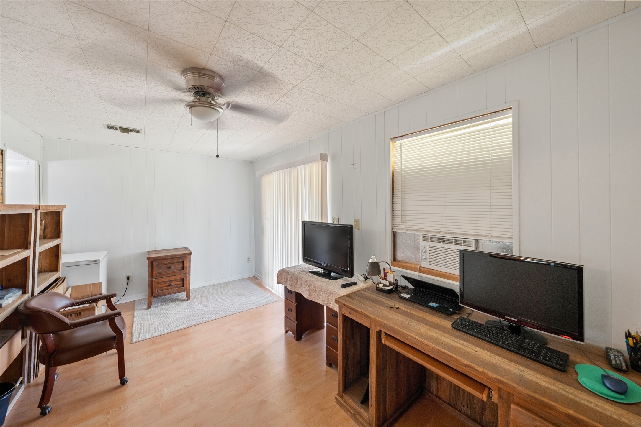 25739 Old Howth Road Hempstead, TX 77445 - Photo 17 of 36 This flexible bonus space just off the kitchen and dining area can easily serve as a game room, study, hobby room or second living area. A ceiling fan, closet, window A/C unit and glass sliders to the covered patio add comfort and function, while giving you plenty of freedom to make the space your own.