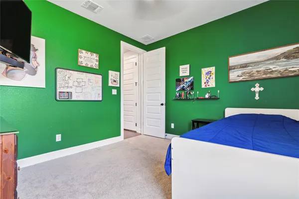 a view of a room with a kitchen and garage