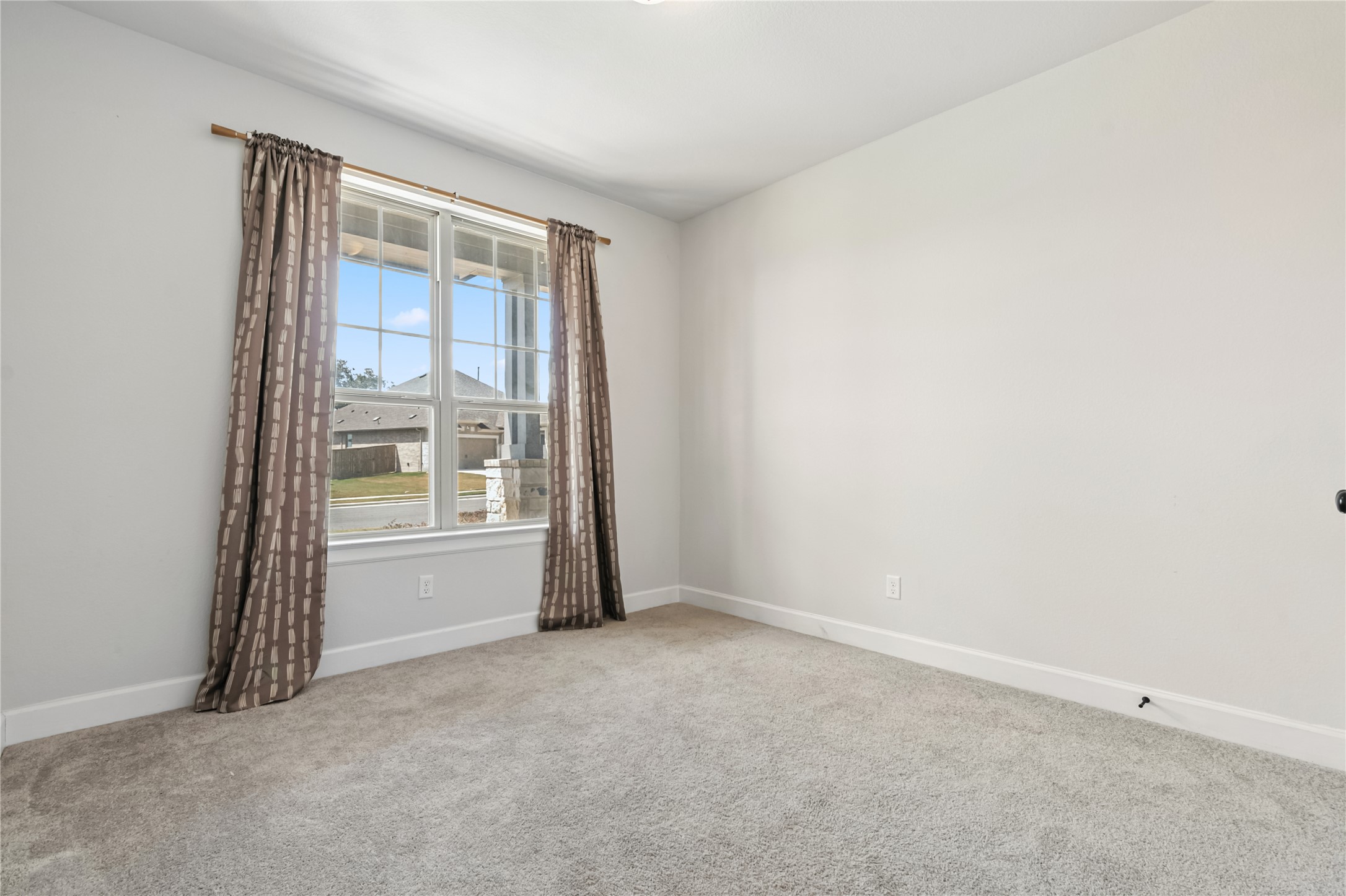 788 Cold Riv Run Kyle, TX 78640 - Photo 15 of 18 a view of an empty room with a window