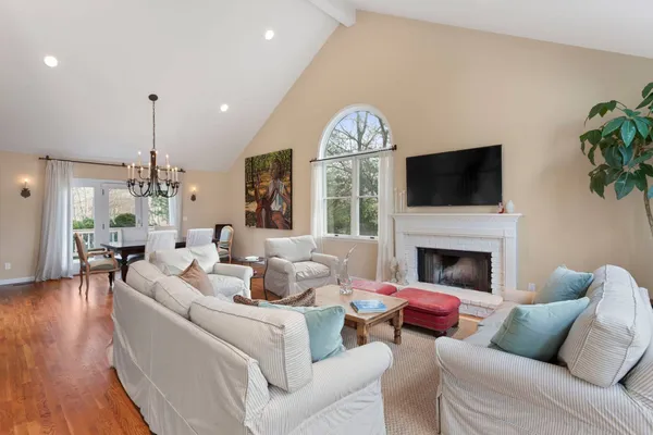 a living room with furniture fireplace and a flat screen tv