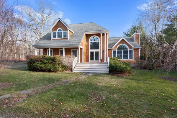 a front view of a house with a yard