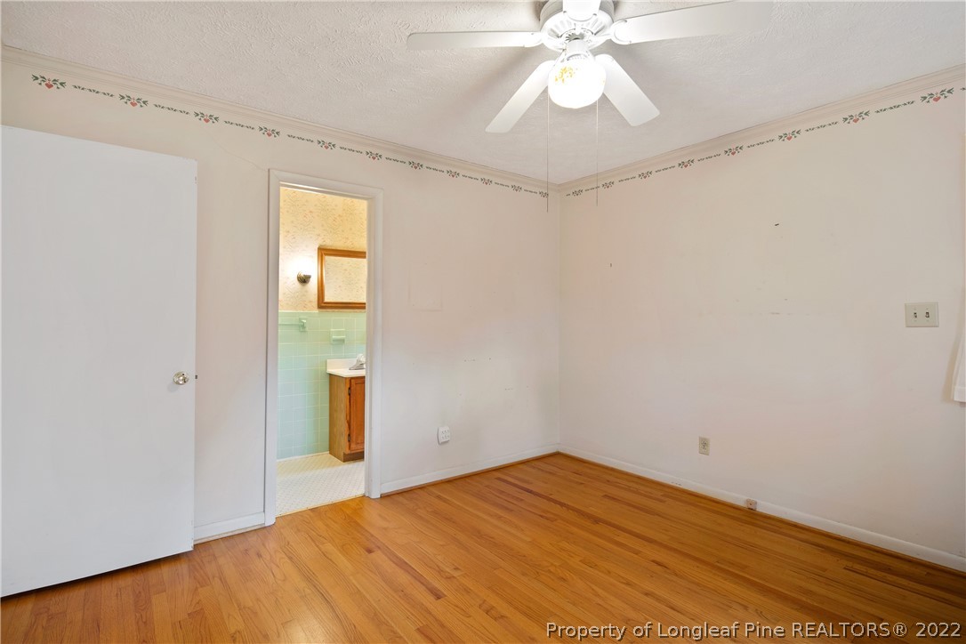 7876 Maxwell Road Stedman, NC 28391 - Photo 29 of 50 a view of empty room with wooden floor
