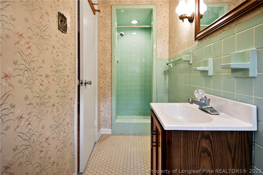 7876 Maxwell Road Stedman, NC 28391 - Photo 30 of 50 a bathroom with a sink a toilet and shower