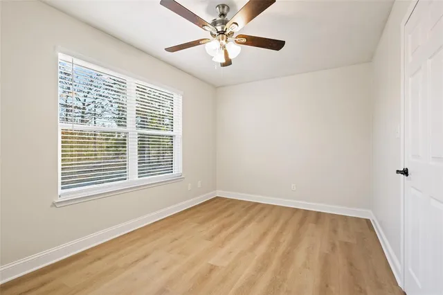 a view of an empty room with a window