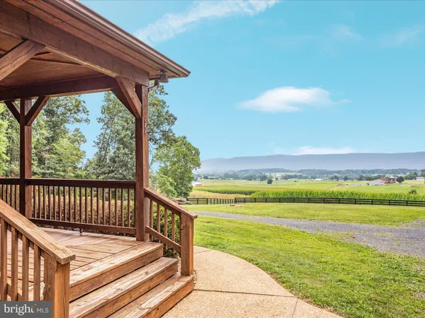 a view of a house with a yard porch and sitting area