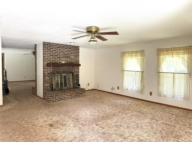 a bedroom with a bed dresser and a window