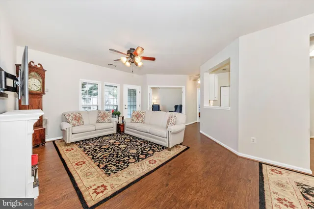a living room with furniture and a rug