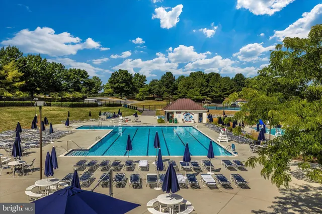 a view of a swimming pool with a patio
