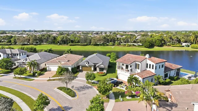 an aerial view of lake residential house with outdoor space and seating