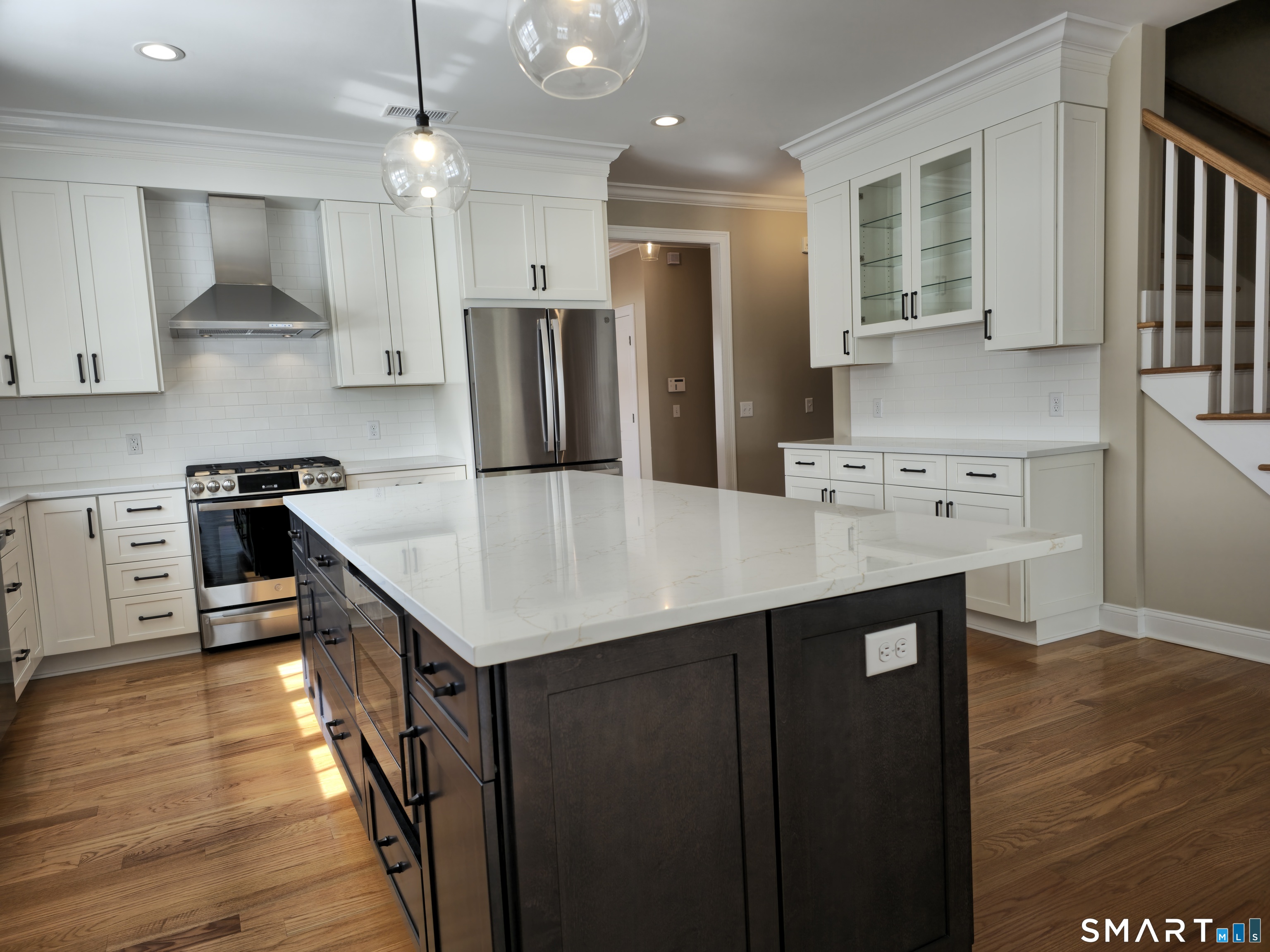 151-153 East Main Street, Unit 24 Clinton, CT 06413 - Photo 9 of 33 a kitchen with stainless steel appliances granite countertop a sink stove and refrigerator