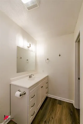 a utility room with cabinets washer and dryer