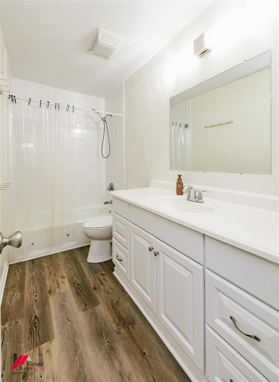 4236 Highway 527 Haughton, LA 71037 - Photo 20 of 38 a spacious bathroom with a granite countertop sink a toilet and a mirror