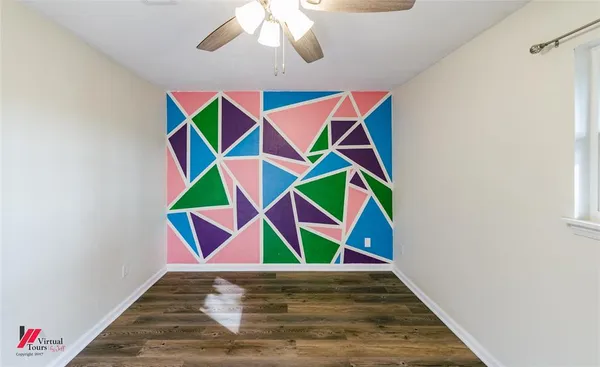 a room with musical instruments and wooden floor
