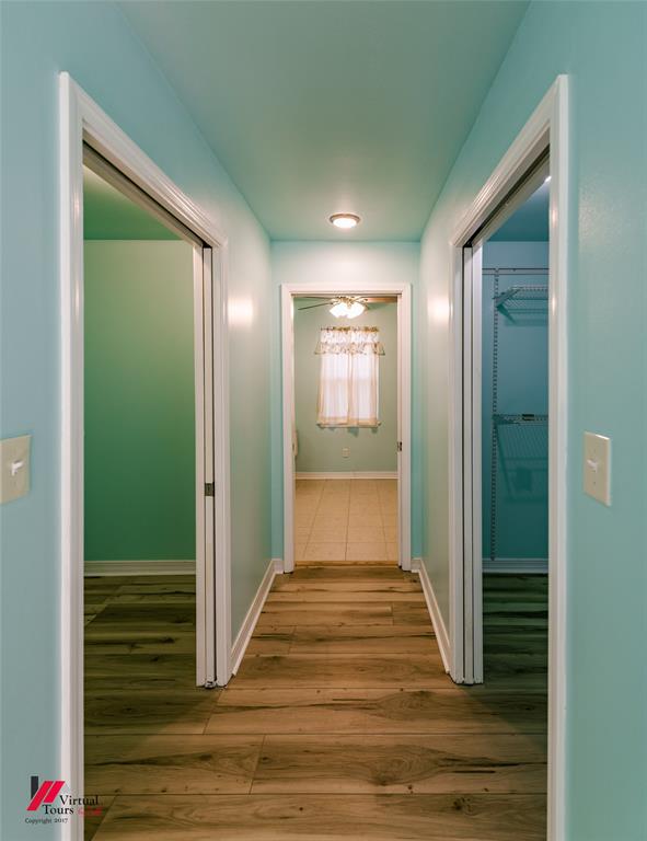 4236 Highway 527 Haughton, LA 71037 - Photo 24 of 38 a view of a hallway with wooden floor and closet