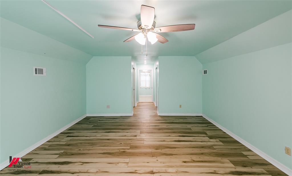 4236 Highway 527 Haughton, LA 71037 - Photo 30 of 38 a view of empty room with wooden floor and fan