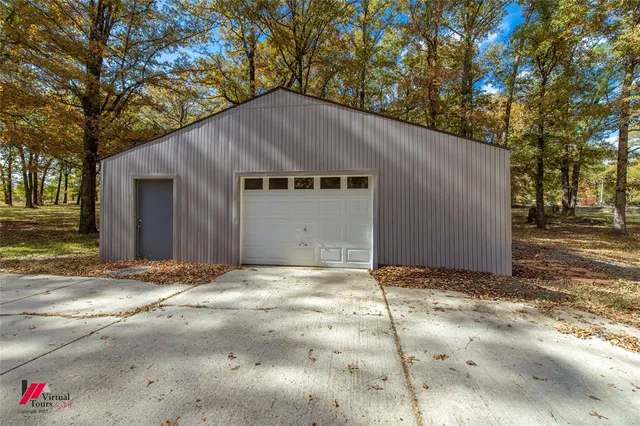 a house with trees in the background