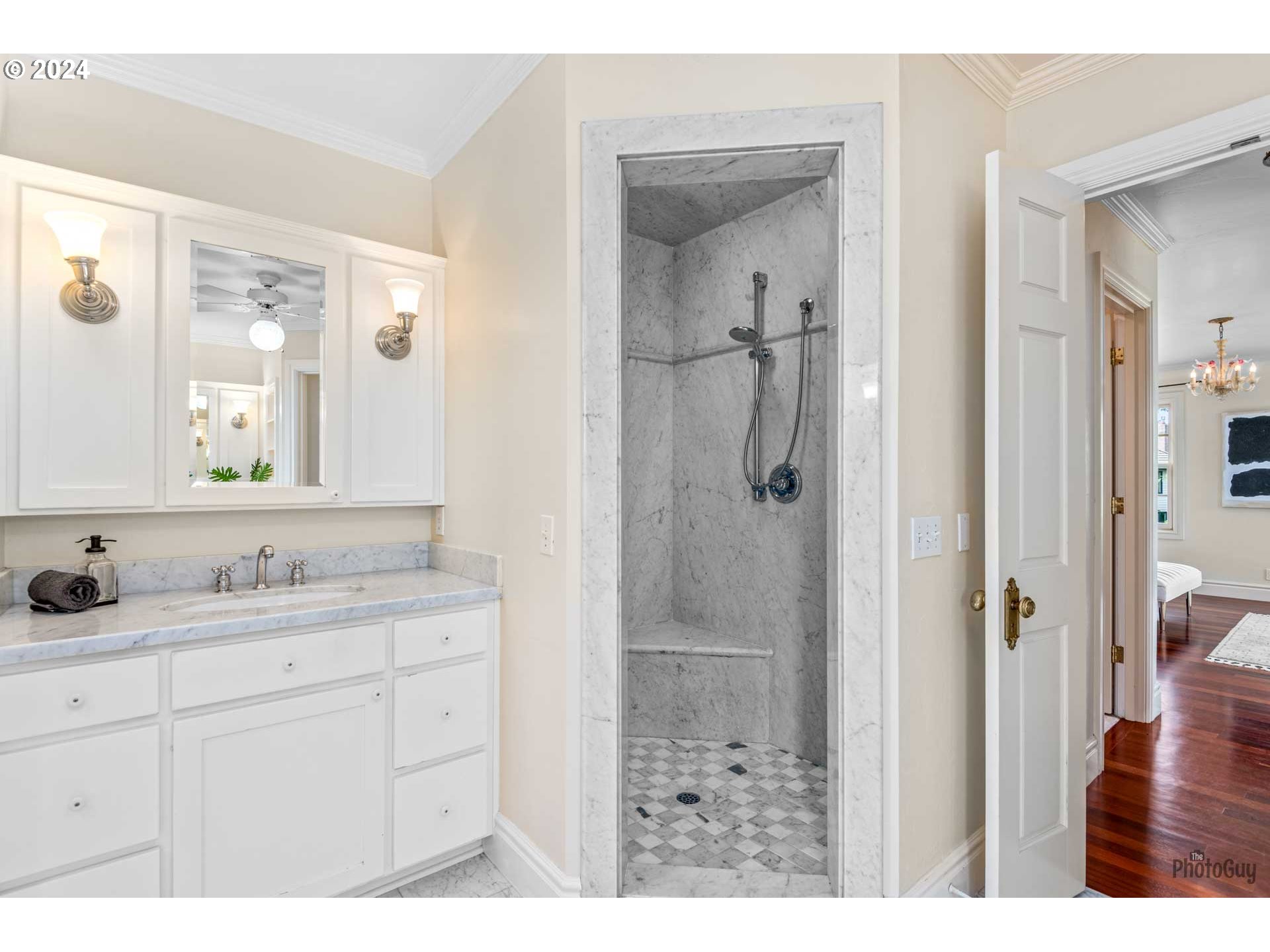 2788 Riverwalk Loop Eugene, OR 97401 - Photo 30 of 48 a bathroom with a shower sink and mirror