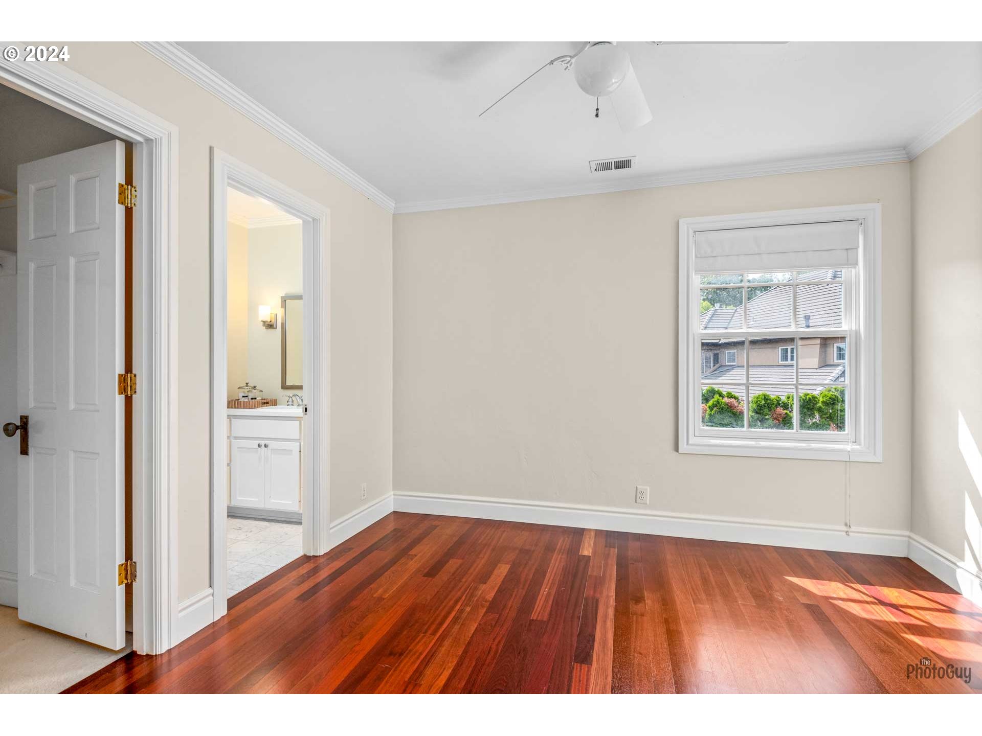 2788 Riverwalk Loop Eugene, OR 97401 - Photo 40 of 48 a view of an empty room with wooden floor and a window