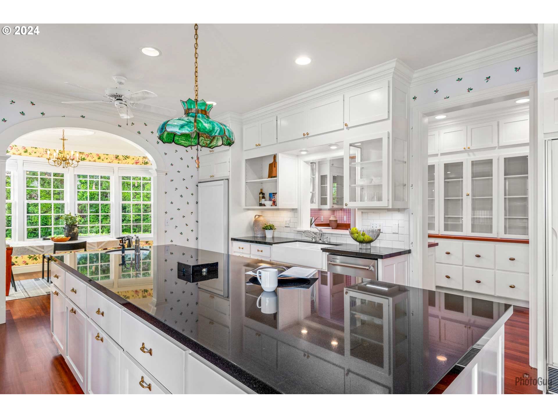 2788 Riverwalk Loop Eugene, OR 97401 - Photo 10 of 48 a kitchen with stainless steel appliances kitchen island granite countertop a stove a sink and a dining table