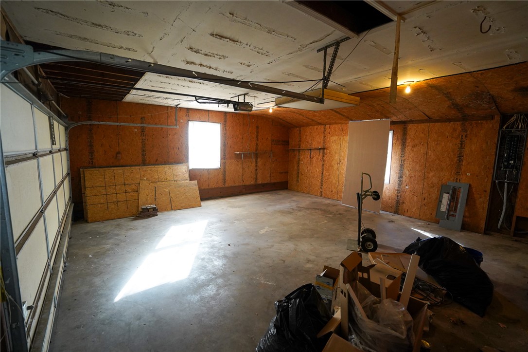 8746 Grubbs-Rex Road Arcanum, OH 45304 - Photo 32 of 38 This spacious garage offers ample storage and potential for various uses.