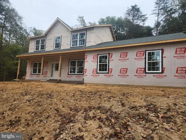 a front view of a house with yard