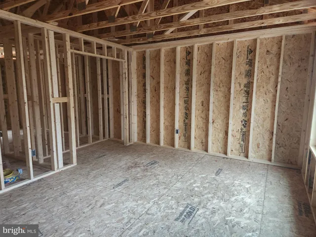 a view of a room with wooden walls