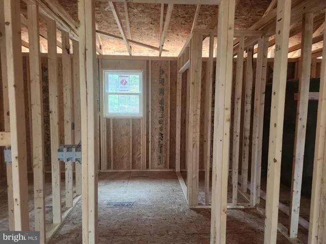 a view of a porch with wooden fence