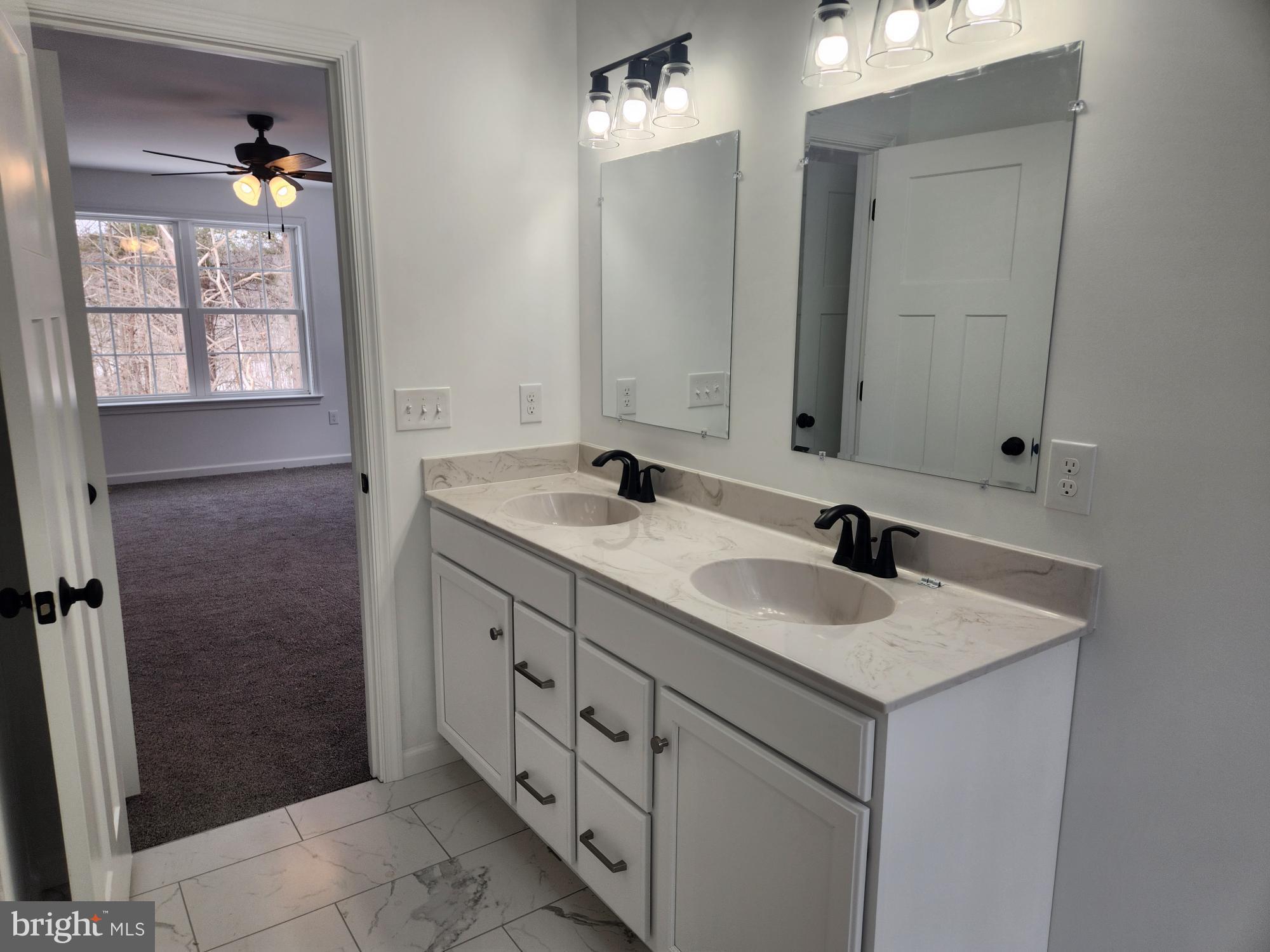 1929 Dunkleberger Road Elliottsburg, PA 17024 - Photo 30 of 48 a bathroom with a double vanity sink a and mirror