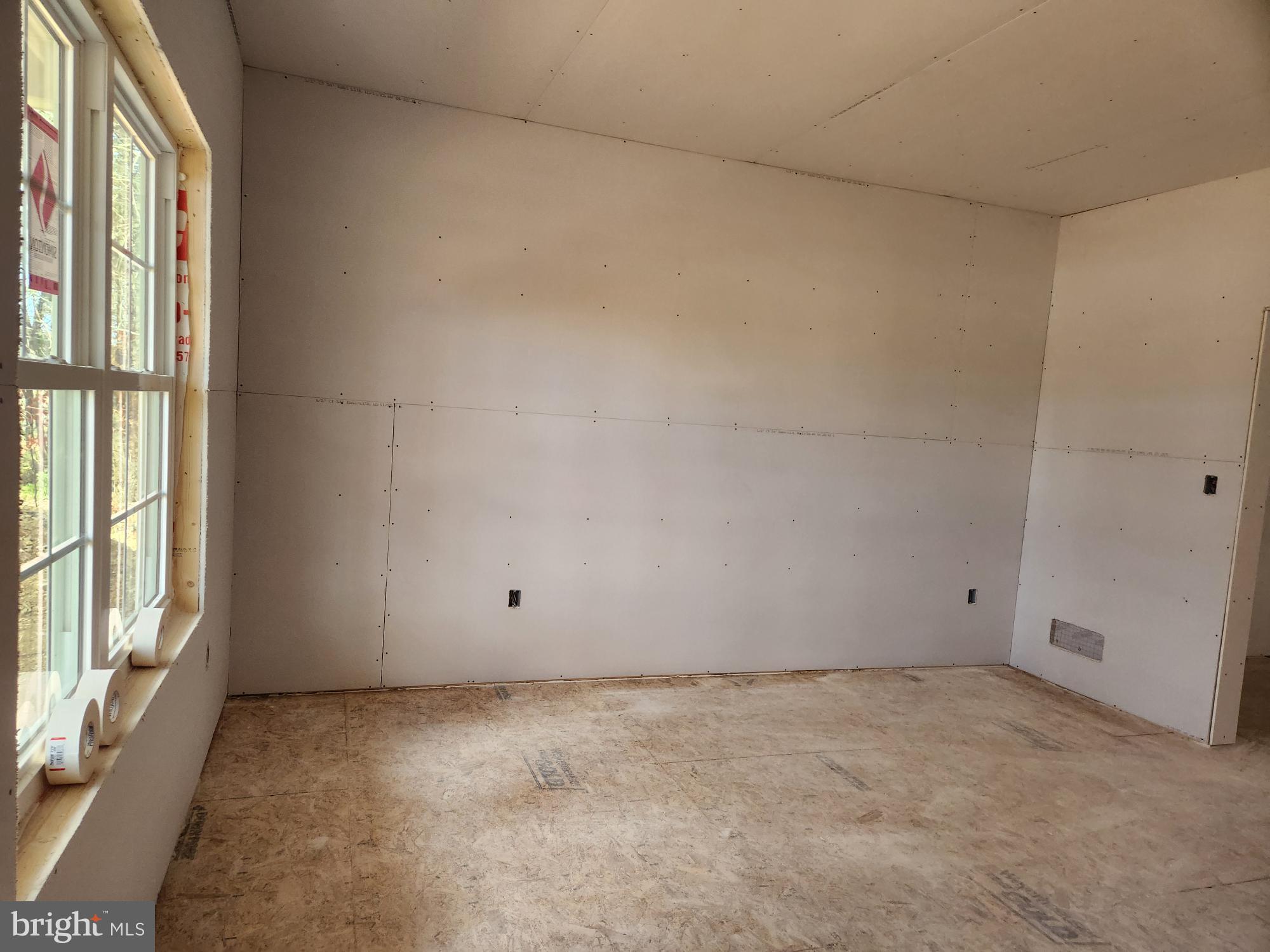 1929 Dunkleberger Road Elliottsburg, PA 17024 - Photo 7 of 23 wooden floor and window in an empty room