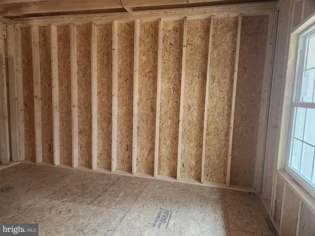 a view of a porch with wooden floor