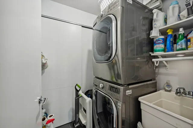 a bathroom with a sink a toilet and a shower