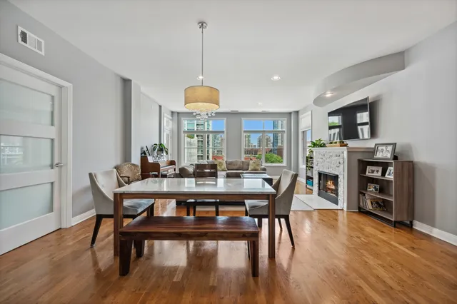 a view of a dining room with furniture window and wooden floor