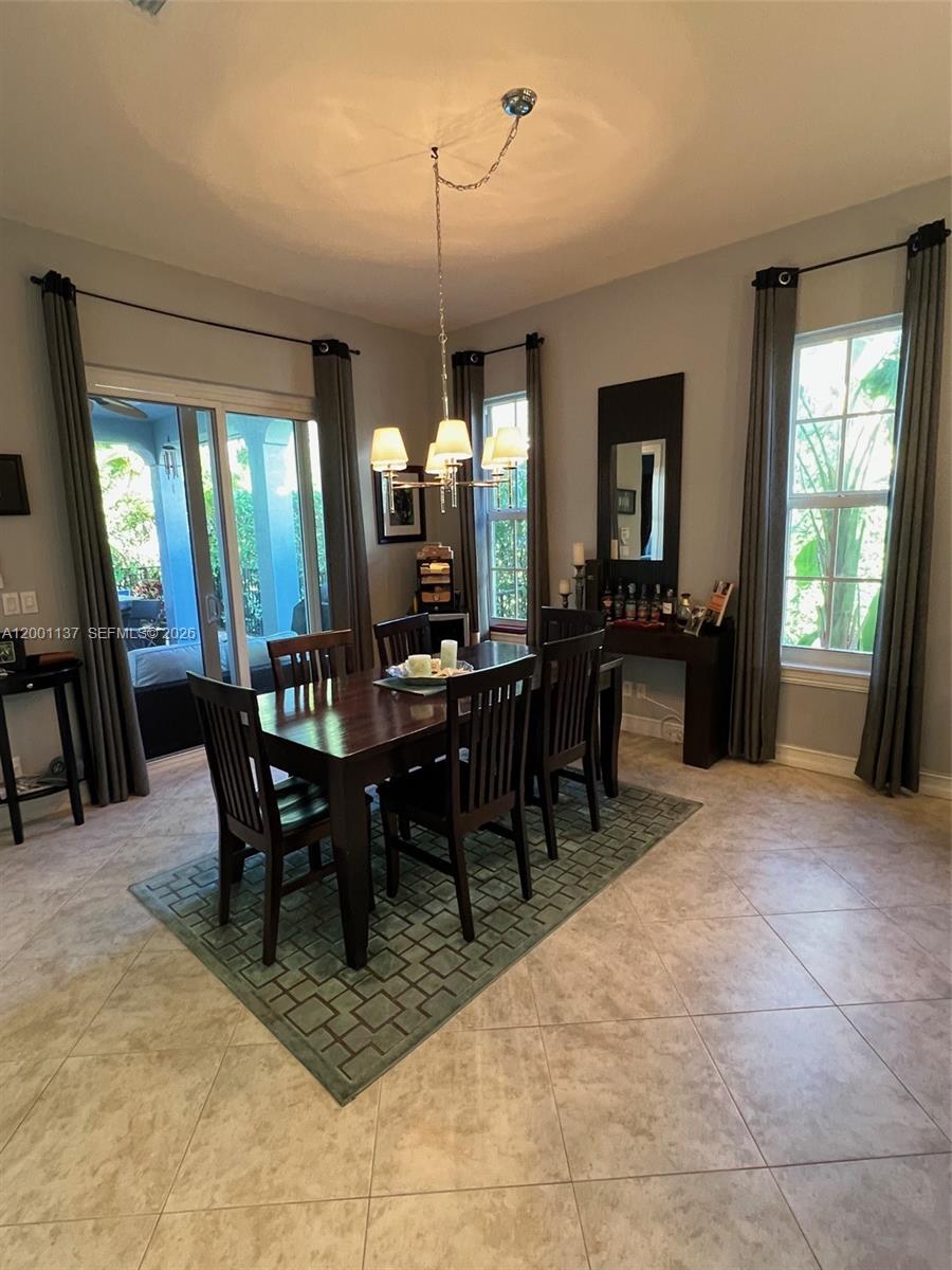 184 West Bay Cedar Circle Jupiter, FL 33458 - Photo 13 of 49 a view of a dining room with furniture