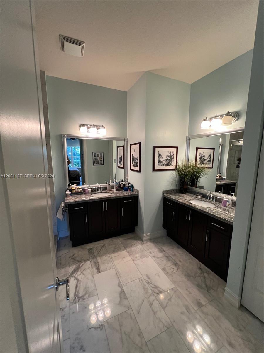184 West Bay Cedar Circle Jupiter, FL 33458 - Photo 21 of 49 a large bathroom with a large tub and sink