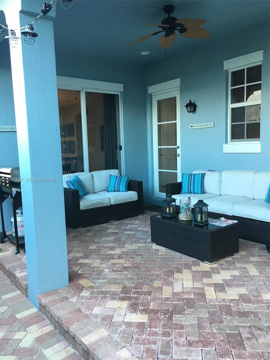 184 West Bay Cedar Circle Jupiter, FL 33458 - Photo 28 of 49 a living room with furniture and a window