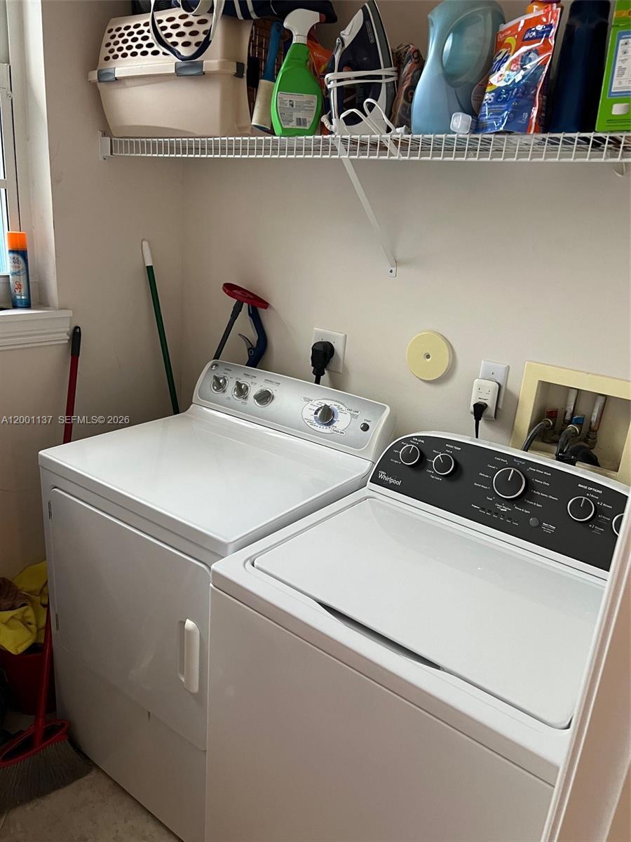 184 West Bay Cedar Circle Jupiter, FL 33458 - Photo 35 of 49 a utility room with dryer and washer