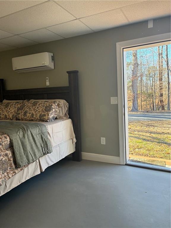 6158 Suwanee Dam Road Sugar Hill, GA 30518 - Photo 12 of 20 a bed sitting in a bedroom next to a window