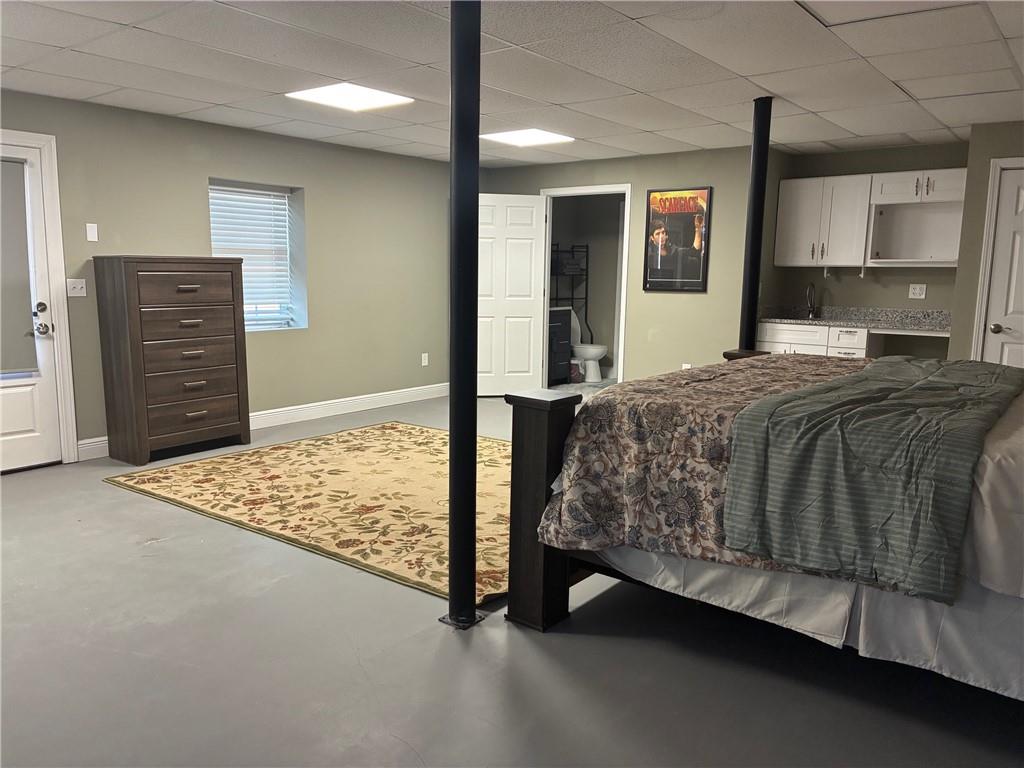 6158 Suwanee Dam Road Sugar Hill, GA 30518 - Photo 16 of 20 a bedroom with a bed and a dresser