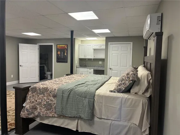 a kitchen with granite countertop a sink and cabinets