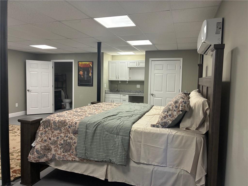 6158 Suwanee Dam Road Sugar Hill, GA 30518 - Photo 17 of 20 a bedroom with bed and window