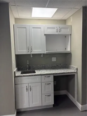 a view of a yard with large trees