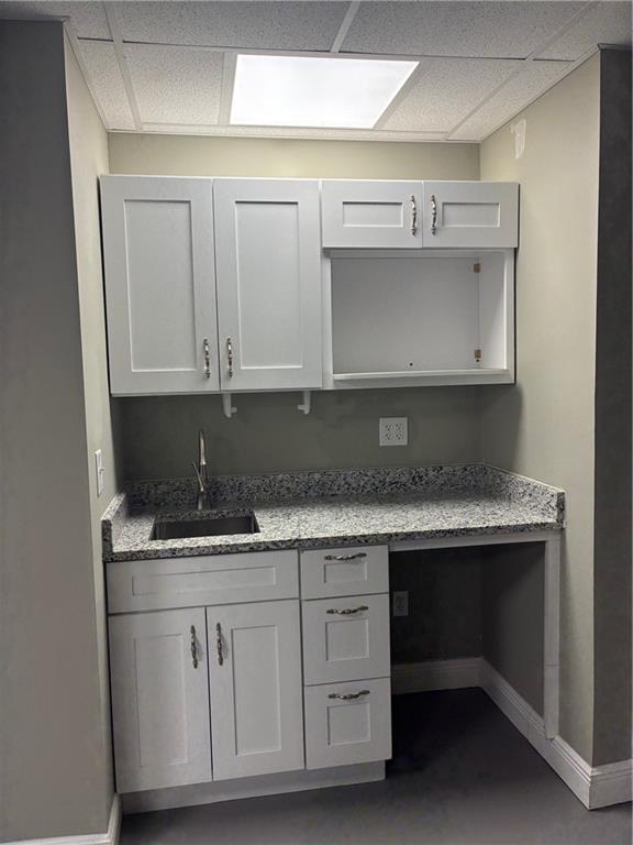 6158 Suwanee Dam Road Sugar Hill, GA 30518 - Photo 18 of 20 a kitchen with granite countertop a sink and cabinets