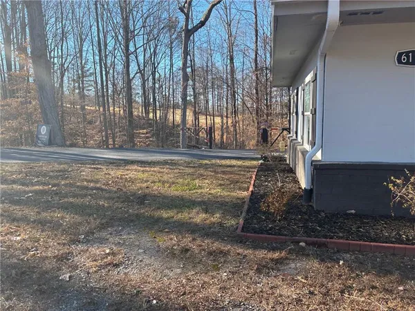 a front view of a house with table and chairs