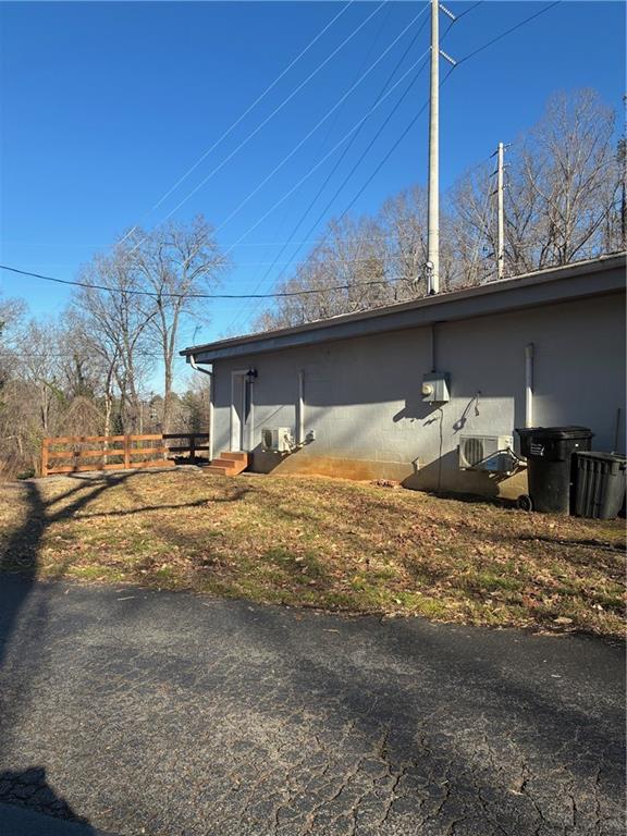 6158 Suwanee Dam Road Sugar Hill, GA 30518 - Photo 20 of 20 a front view of a house with table and chairs