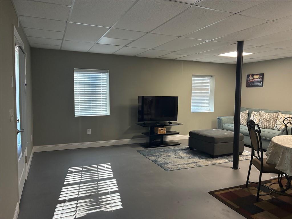 6158 Suwanee Dam Road Sugar Hill, GA 30518 - Photo 3 of 20 a living room with furniture and a flat screen tv