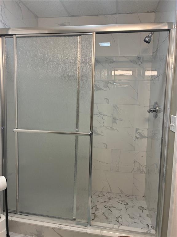 6158 Suwanee Dam Road Sugar Hill, GA 30518 - Photo 10 of 20 a bathroom with a glass shower door