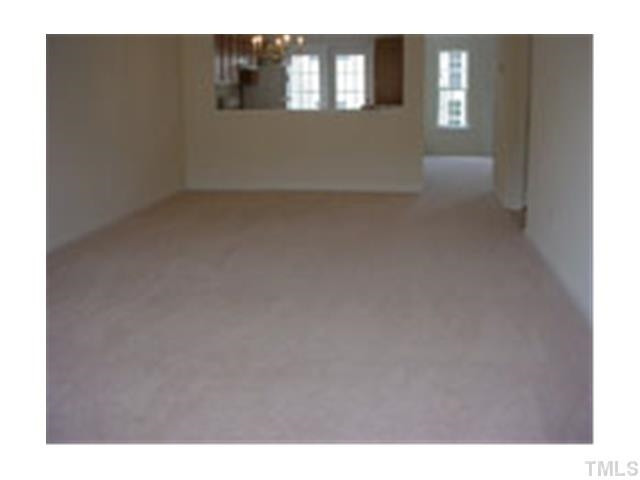 3005 Portrait Drive Cary, NC 27513 - Photo 2 of 6 a view of an empty room and window