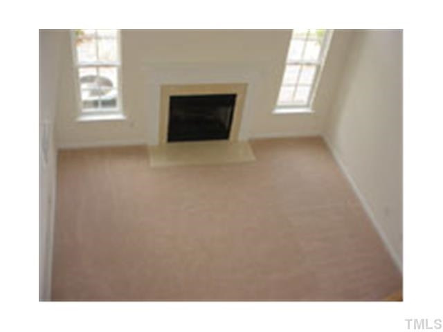 3005 Portrait Drive Cary, NC 27513 - Photo 4 of 6 a open hall with a fireplace