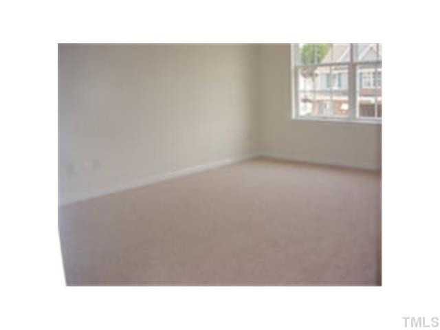 3005 Portrait Drive Cary, NC 27513 - Photo 5 of 6 a open hall with a floor to ceiling window