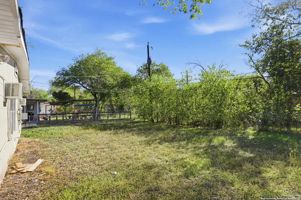 a backyard of a house with lots of green space
